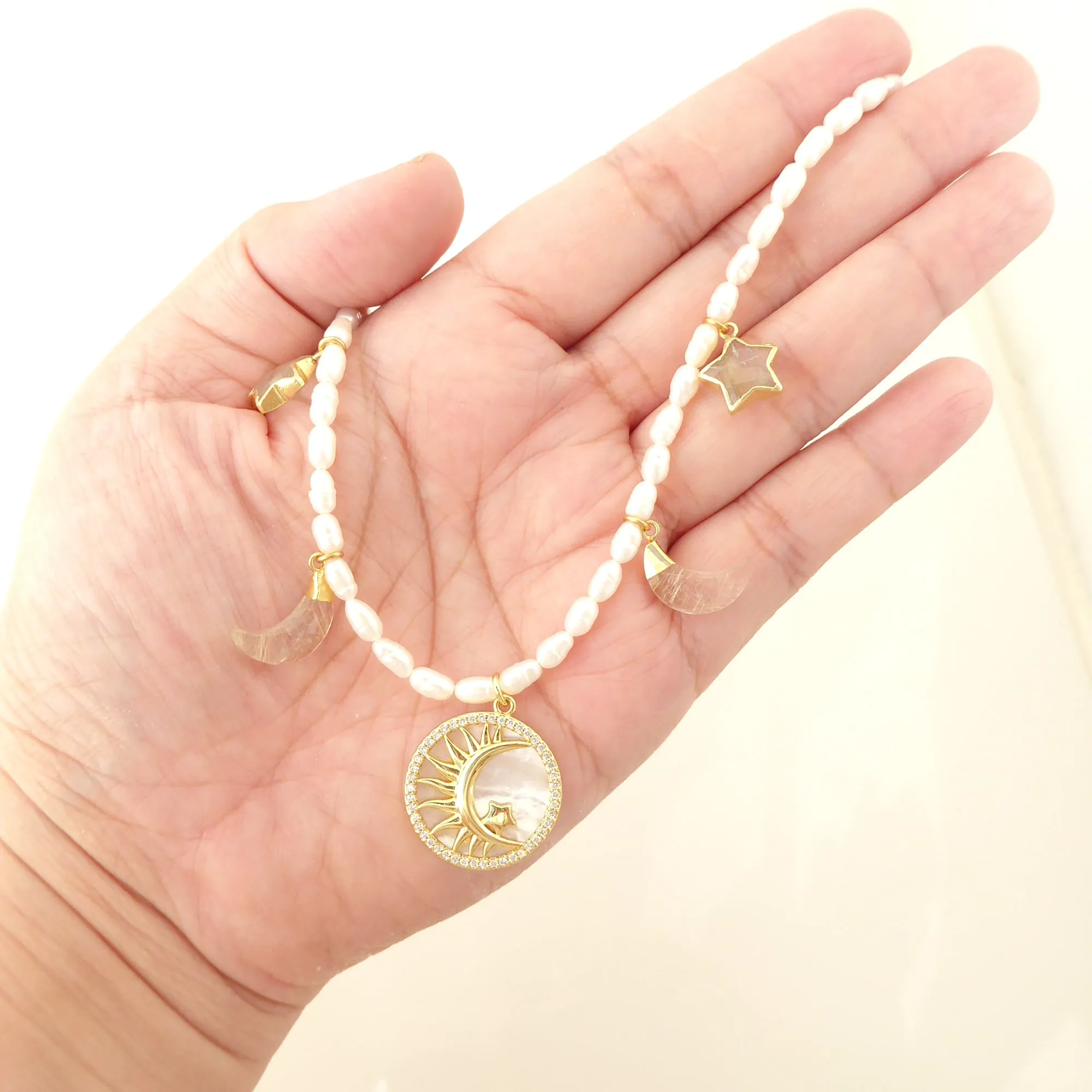 Crescent and star pearl necklace