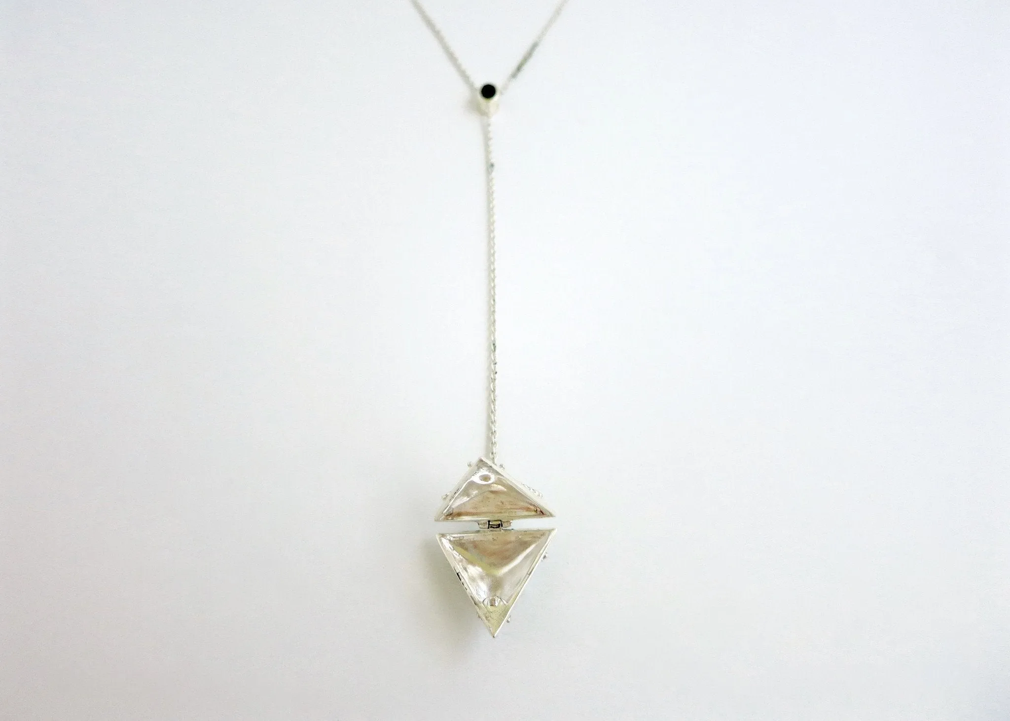 Elegant, vintage-inspired, sterling silver lariat necklace with a triangular granulation-work locket