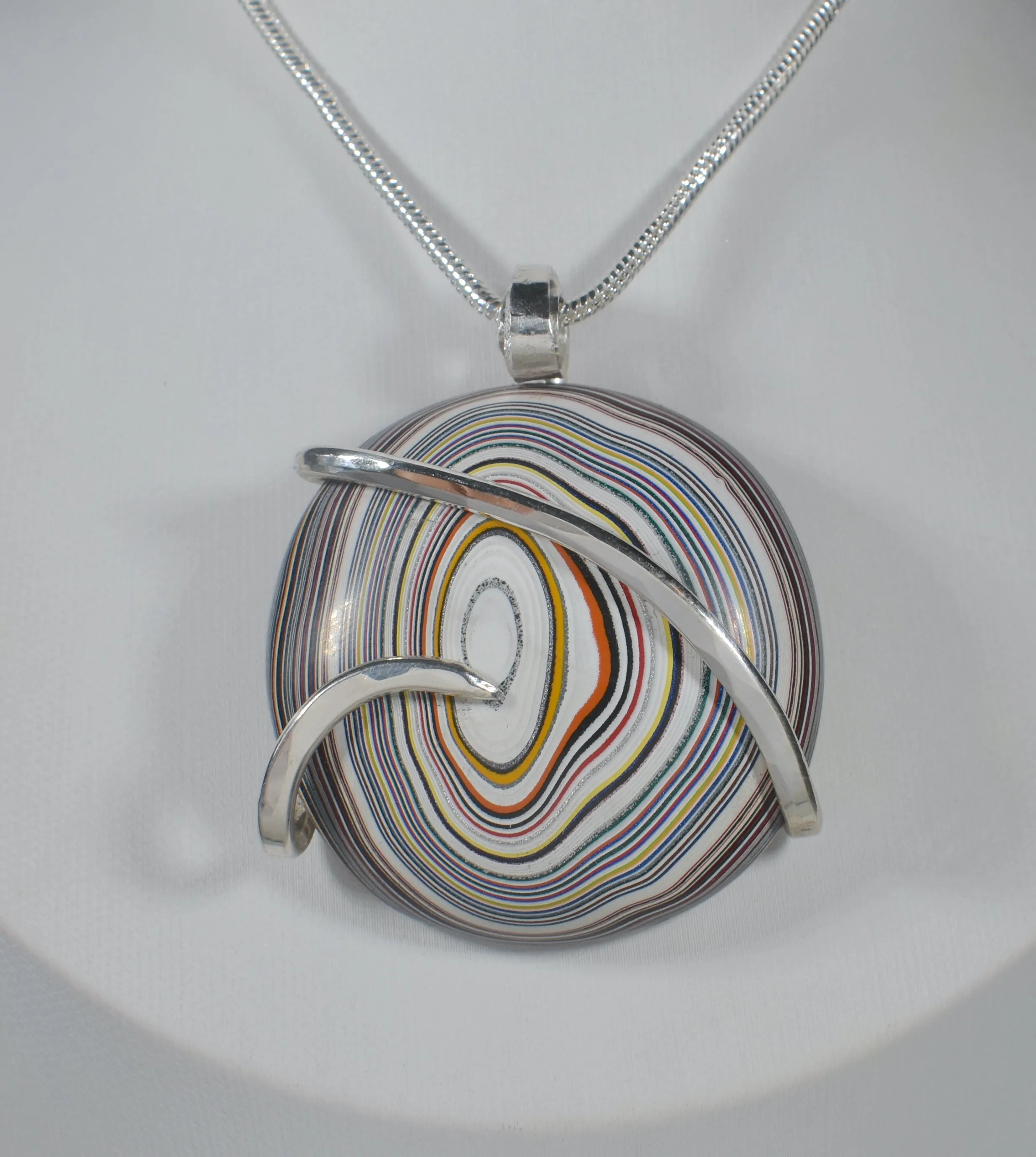 Fordite Handmade Stone Pendant Wrapped in Silver