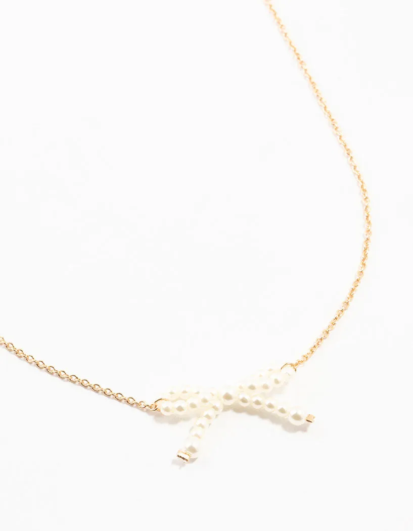 Gold Pearl Bow Necklace