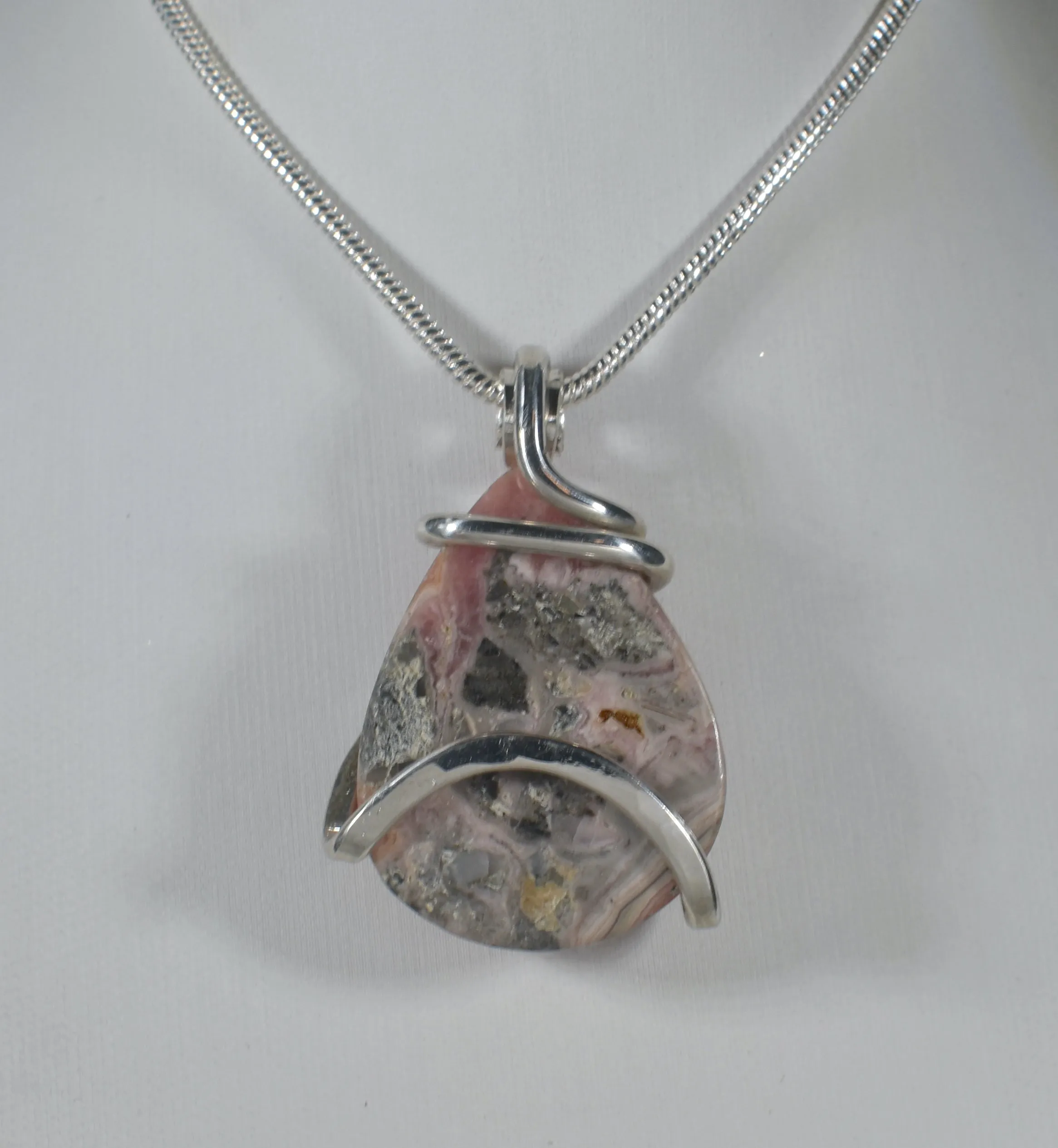 Rhodochrosite Handmade Crystal Pendant Wrapped in Silver