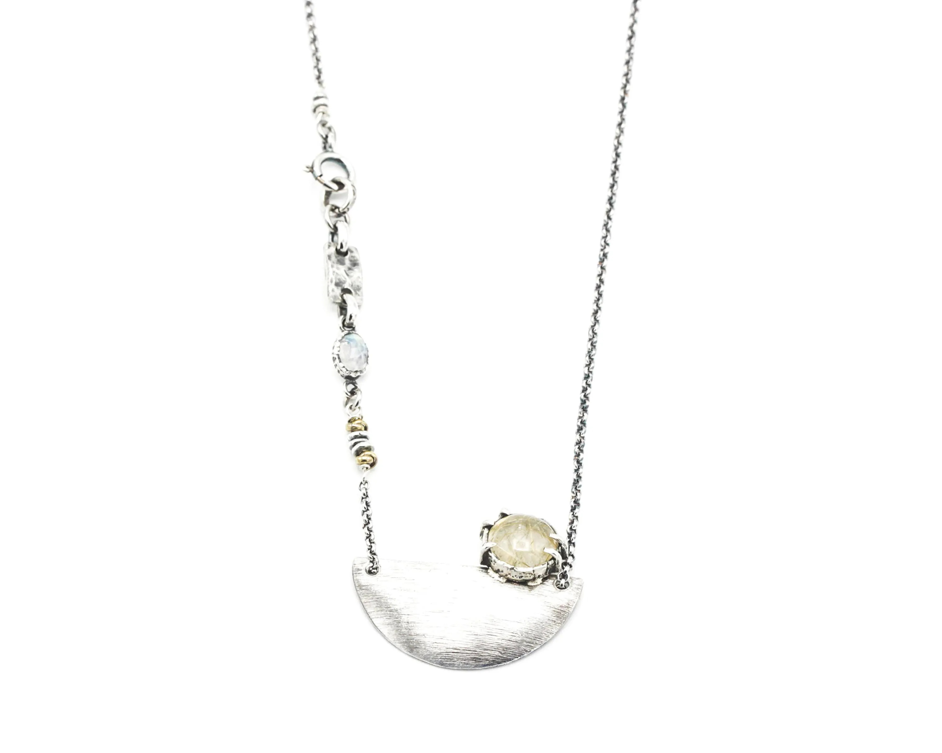 Rutilated quartz cabochon pendant necklace with silver plate in semi-oval shape on sterling silver chain